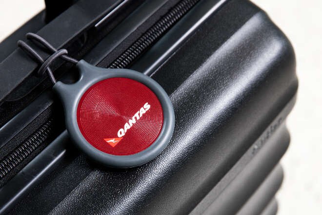 Black suitcase with qantas tag