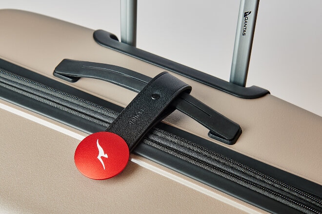 Qantas Luaggage Tag on a gold suitcase