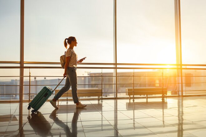 Women with carryo9n baggage walking in the terminal