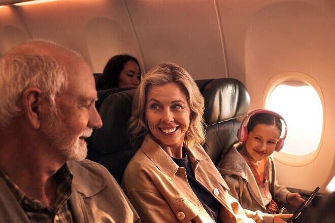 Family sitting in economy cabin