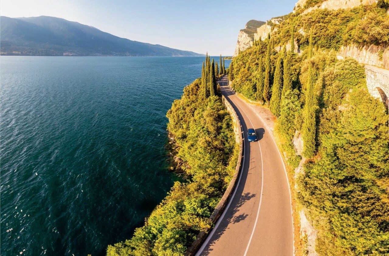 Car driving down the coast of Italy
