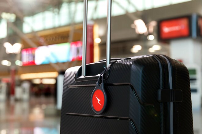 Black suitcase with qantas tag