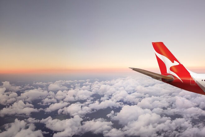 Plane tail in the clouds