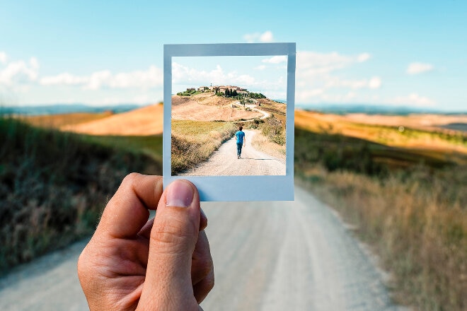 Person holding a polariod