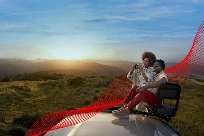 Man and woman sitting outside