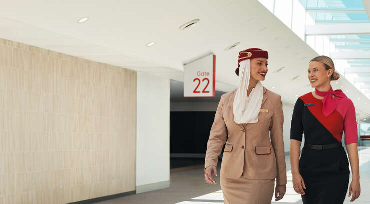 Qantas and Emirates crew walking through the airport
