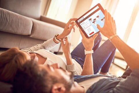 Couple checking map on an ipad