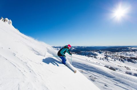 Skiing down the slopes of Perisher, New South Wales