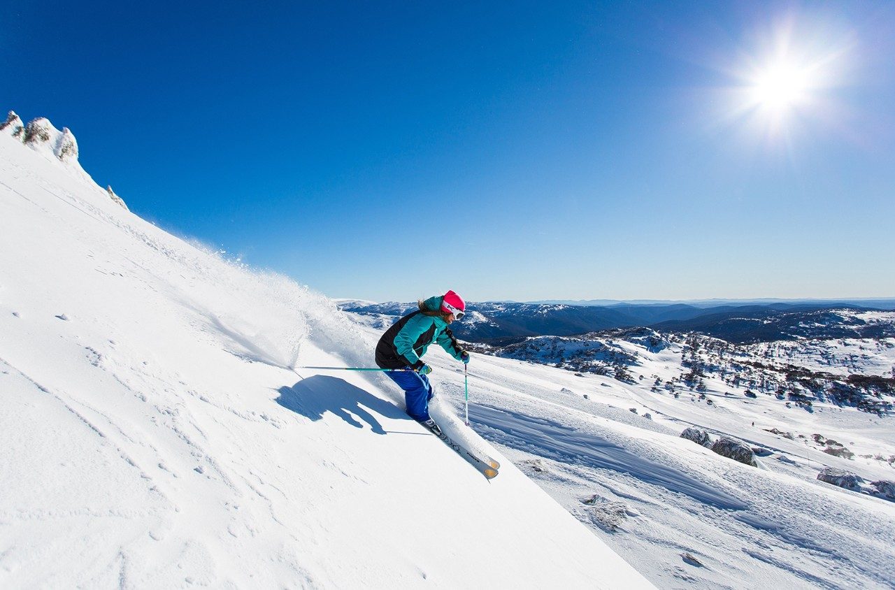 Skiing down the slopes of Perisher, New South Wales