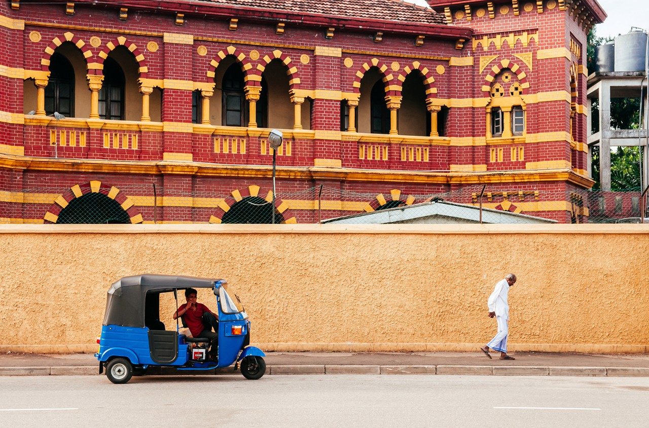 A tuk tuk outside of the Victoria Memorial Building in Colombo, Sri Lanka