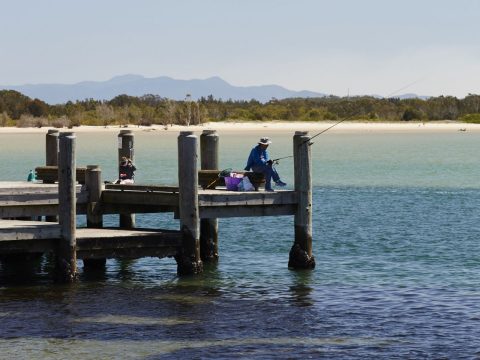 A fisherman on the jetty at Port Macquarie