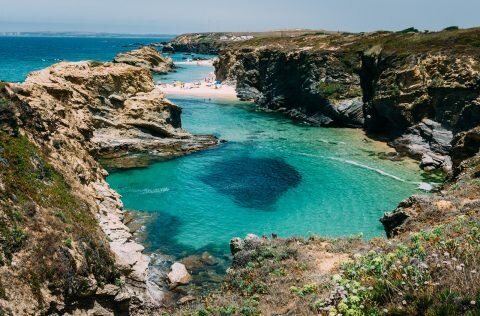 beach cliffside ocean portugal coastal village of comporta
