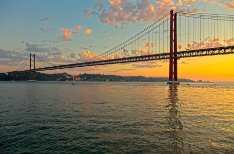 bridge over riverfront lisbon portugal